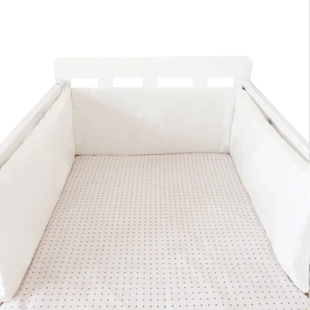 Protector de cuna con laterales
